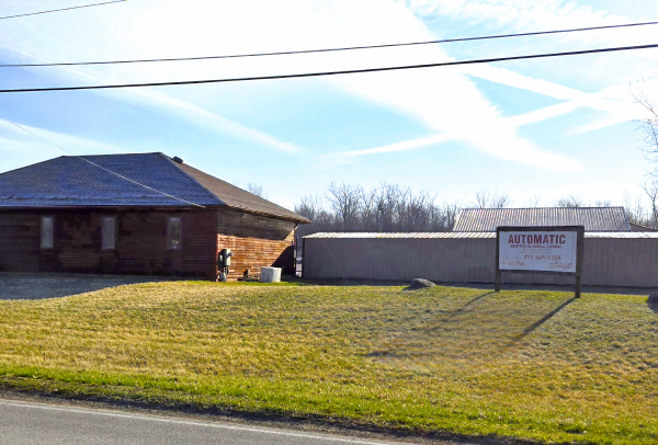 Septic service building with sign