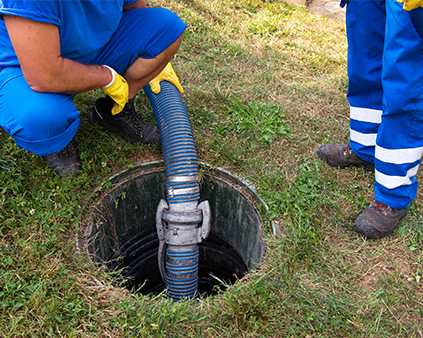 Septic well pumping service workers