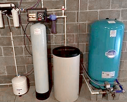 Water treatment system basement installation