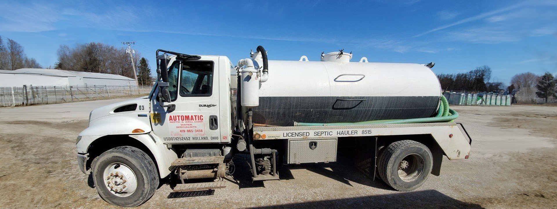 Septic service truck outdoors field